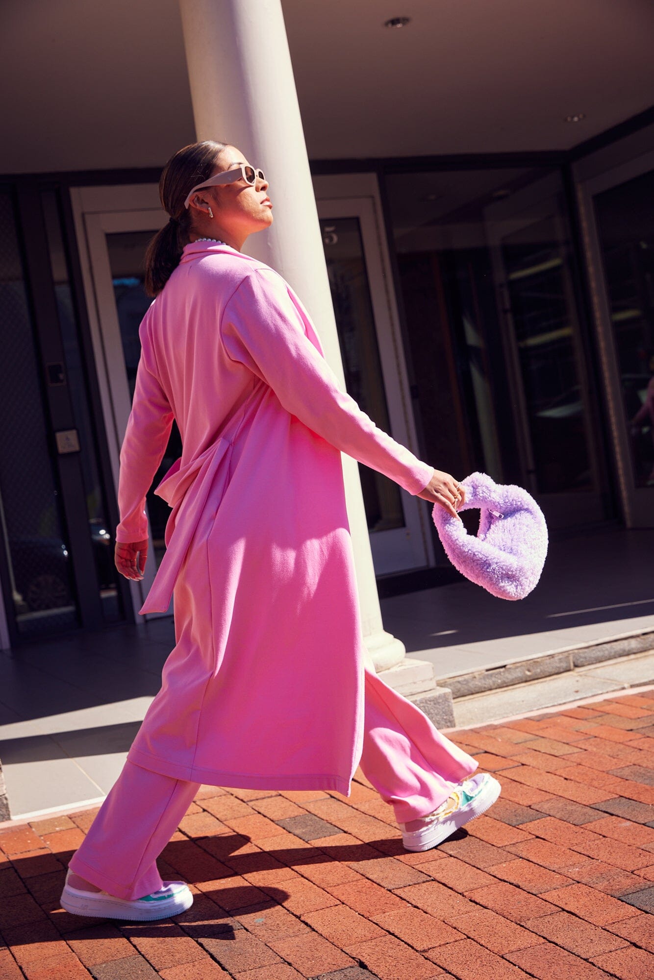M Street model wearing the pink Zahra Over Belly Duster Cardigan